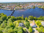 Ätran slingrar sig stilla fram mellan grönskan. När den passerar under den vackra Tullbron breddas ån och liknar mest en liten insjö.